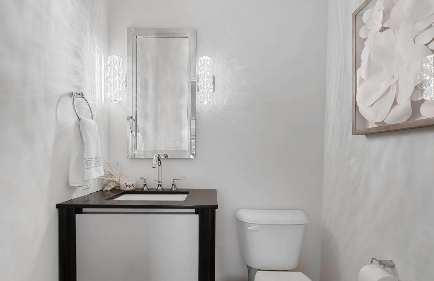 421 Edge Of Woods Road Southampton, NY 11968 - Photo 10 of 33 Half bathroom featuring toilet and vanity