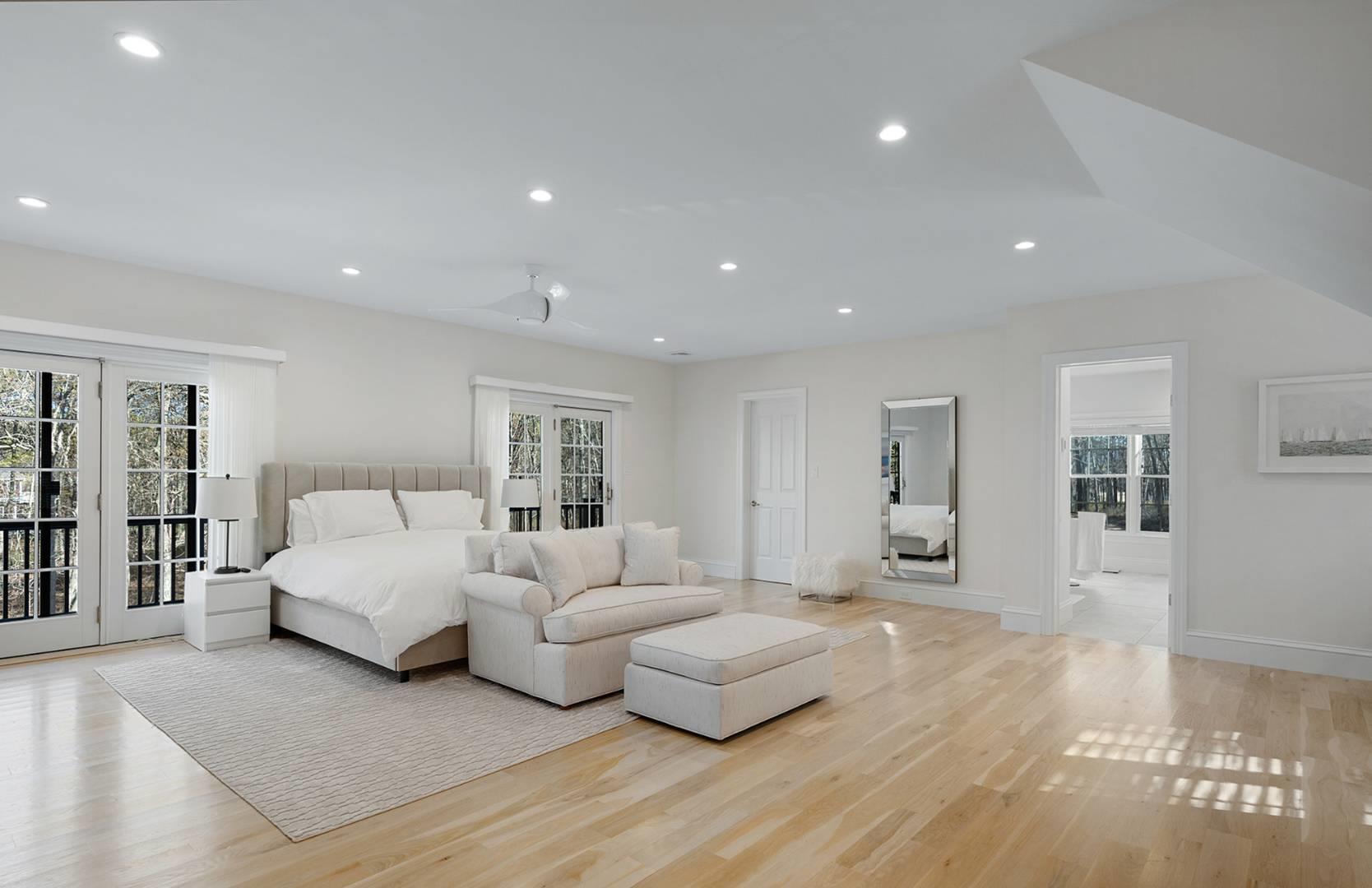 421 Edge Of Woods Road Southampton, NY 11968 - Photo 15 of 33 Bedroom with access to outside, multiple windows, light wood-type flooring, and recessed lighting