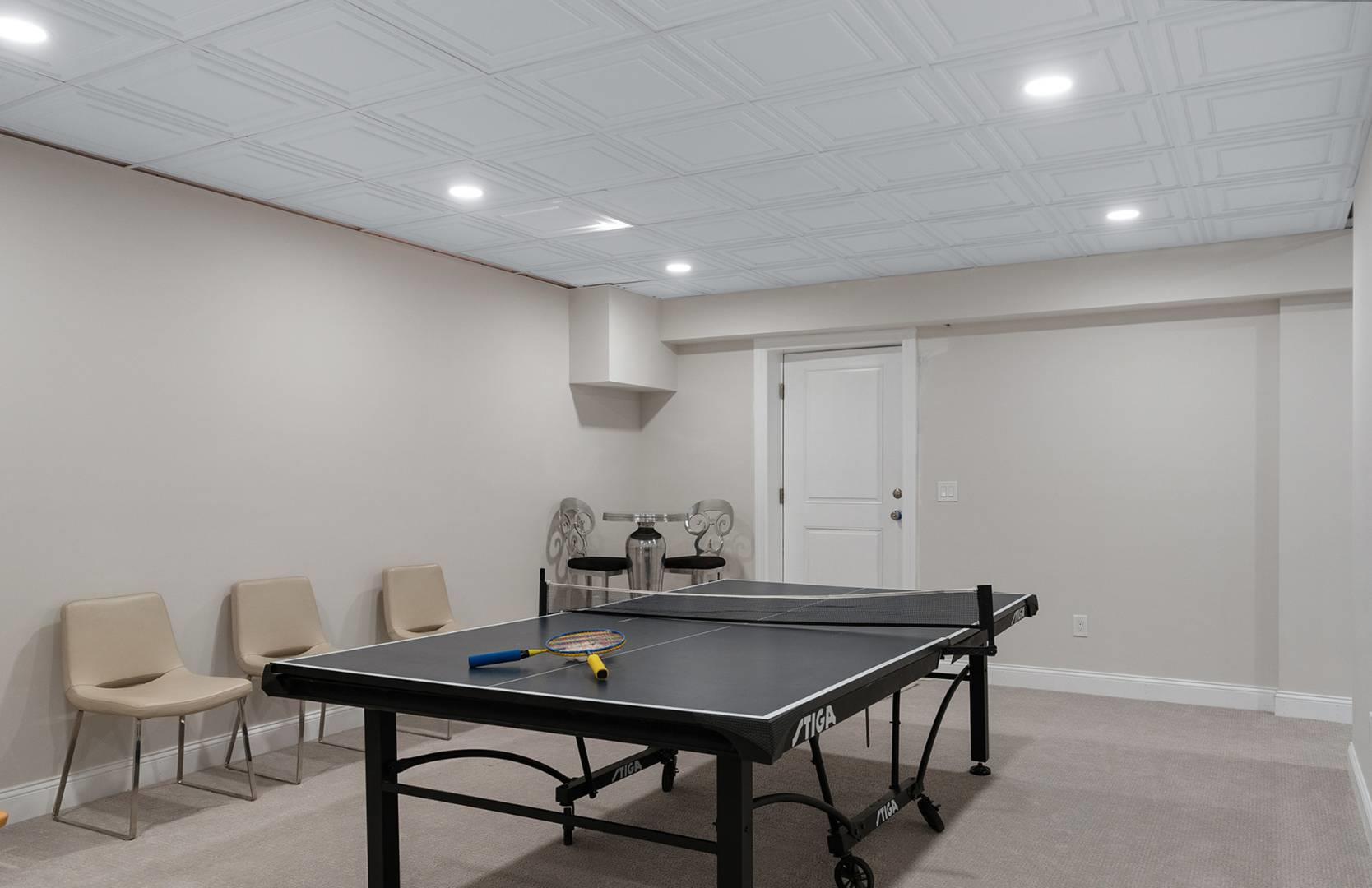 421 Edge Of Woods Road Southampton, NY 11968 - Photo 22 of 33 Rec room with recessed lighting, light colored carpet, and an ornate ceiling