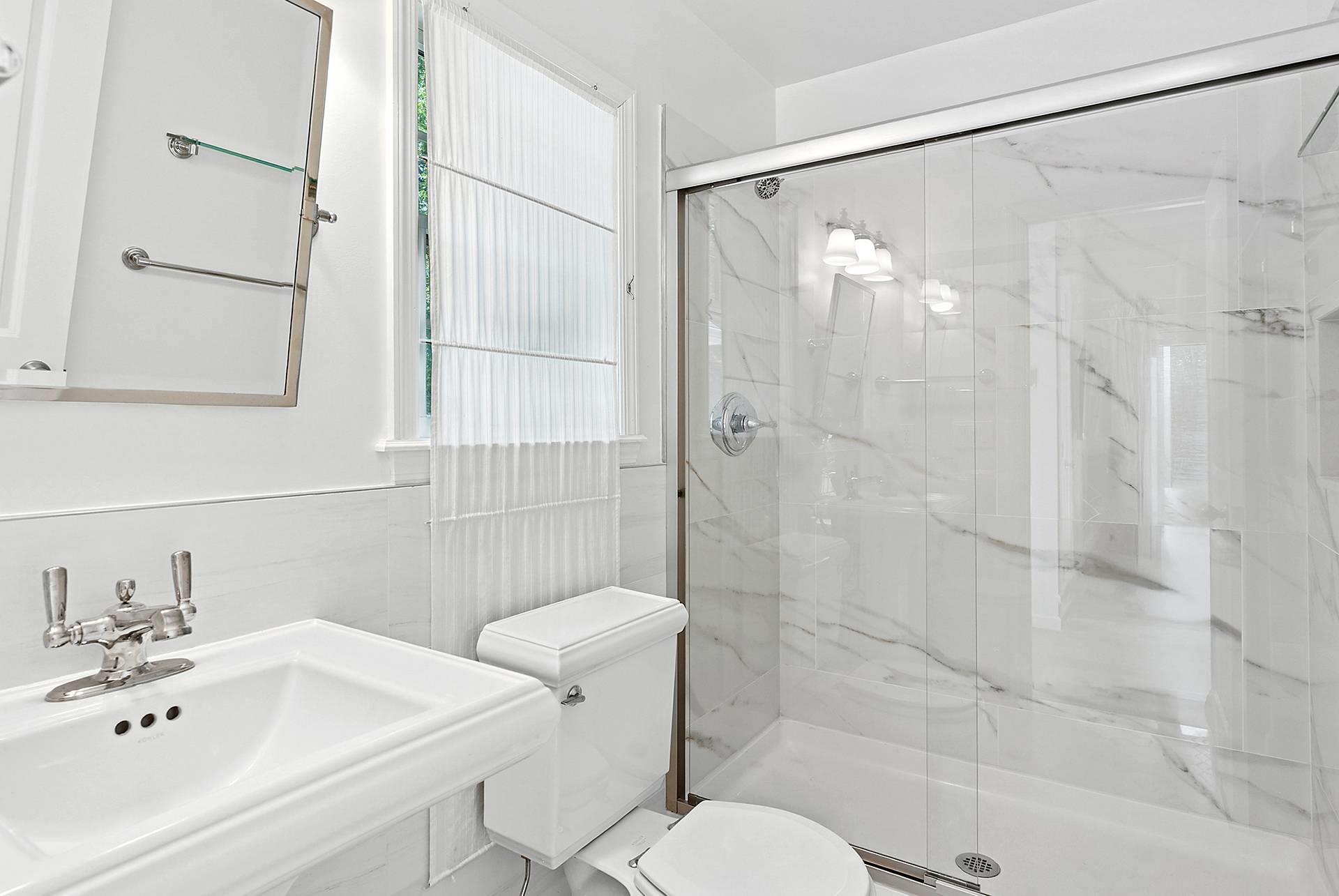421 Edge Of Woods Road Southampton, NY 11968 - Photo 28 of 33 Bathroom featuring toilet and a marble finish shower