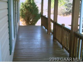 5 Hidden Spring Lane Swoope, VA 24479 - Photo 8 of 10 a view of a porch with wooden floor and a yard