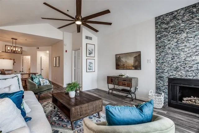 a living room with furniture and a fireplace