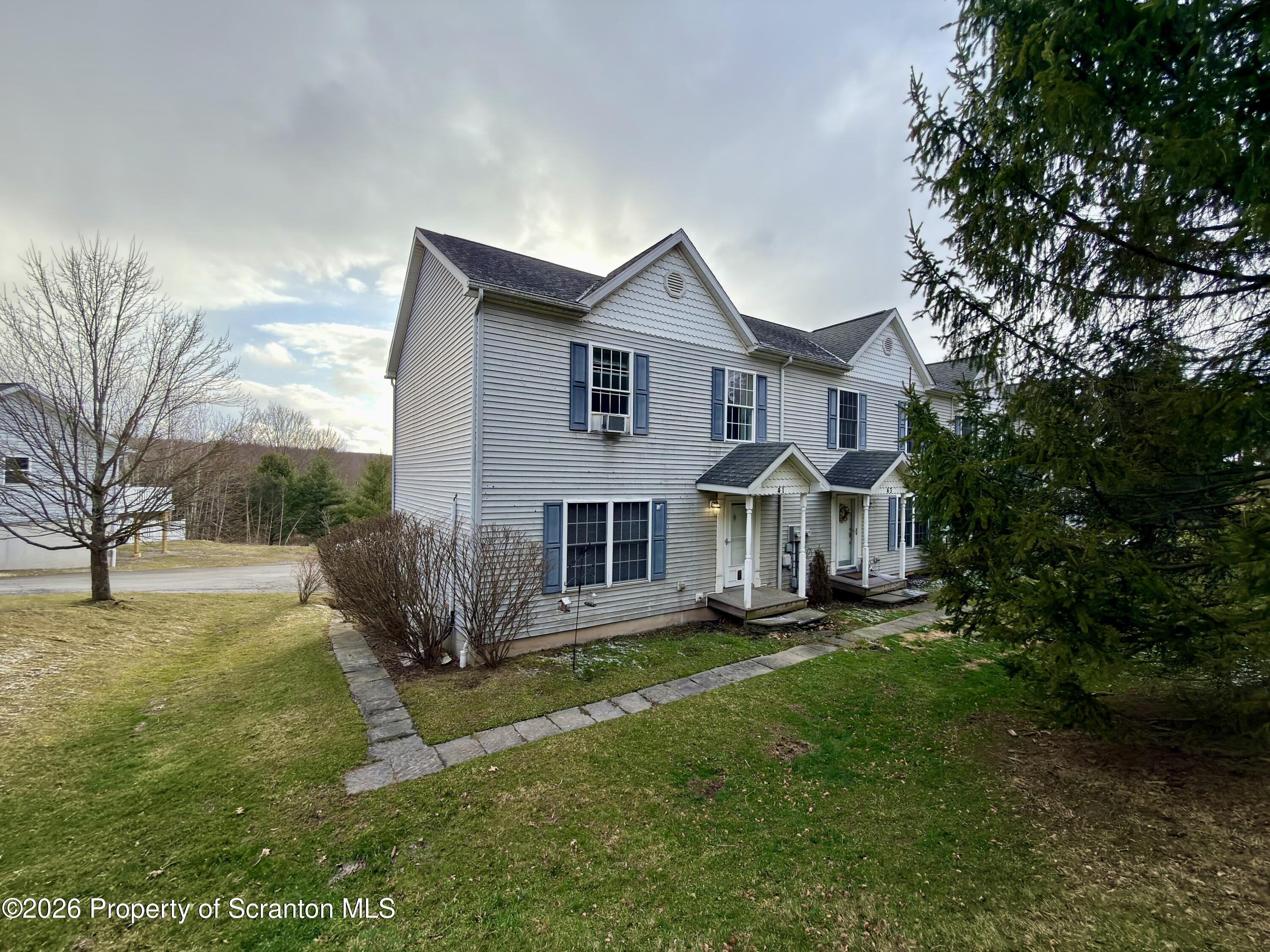41 South Waterford Road Dalton, PA 18414 - Photo 1 of 22 a front view of house with yard and green space