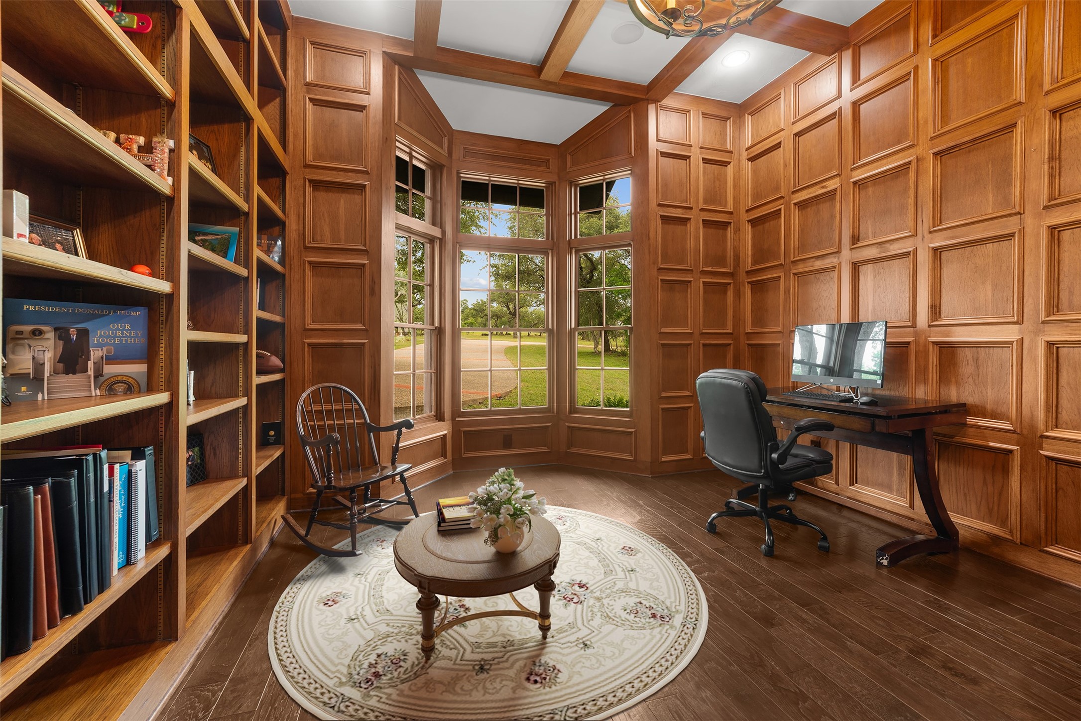 34000 Smithson Valley Road Bulverde, TX 78163 - Photo 12 of 50 The handsome study features rich wood paneling, custom built-in shelving, and large windows overlooking the front grounds. A refined workspace perfectly suited for a home office, library, or private retreat.