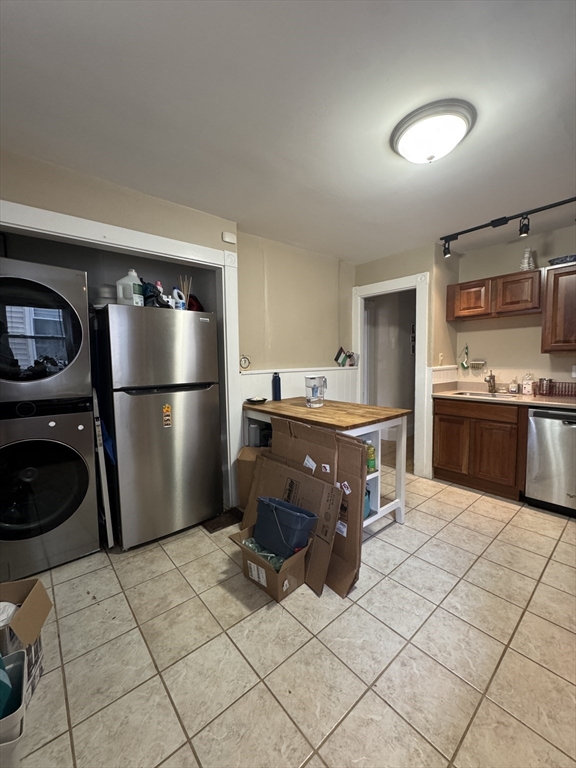 5 Spring Park Avenue, Unit 1 Boston, MA 02130 - Photo 10 of 24 a kitchen with stainless steel appliances granite countertop a refrigerator a stove a sink and a microwave