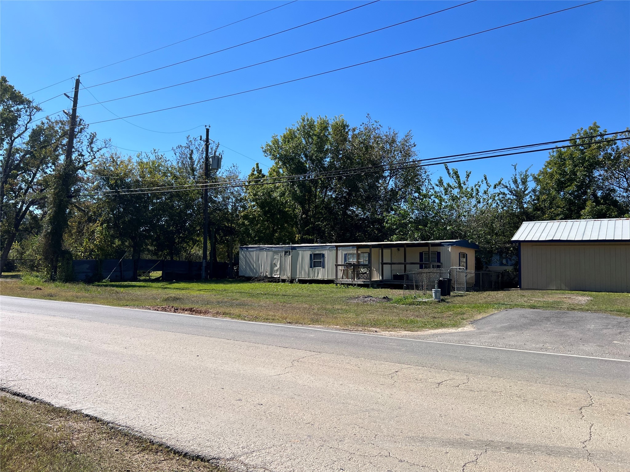 13935 Smith Road, Unit 101 Humble, TX 77396 - Photo 14 of 14 a backyard of a house with lots of green space