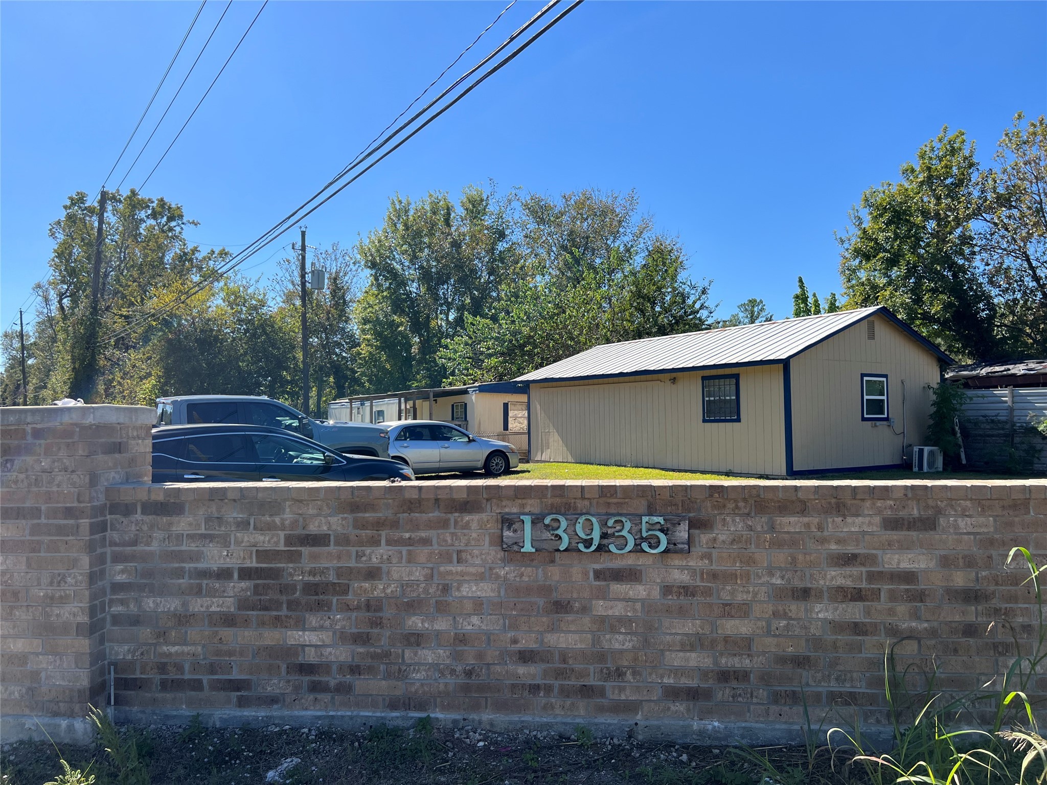 13935 Smith Road, Unit 101 Humble, TX 77396 - Photo 8 of 14 a view of a house with a yard