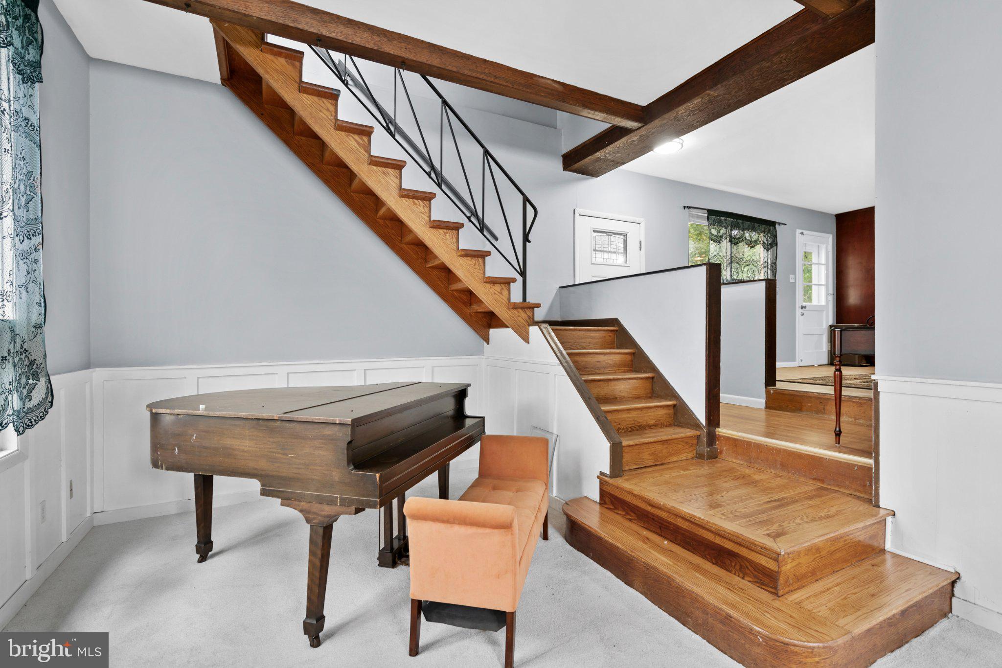 609 Foster Road Cheltenham, PA 19012 - Photo 23 of 44 Elegant entryway with wooden staircase.