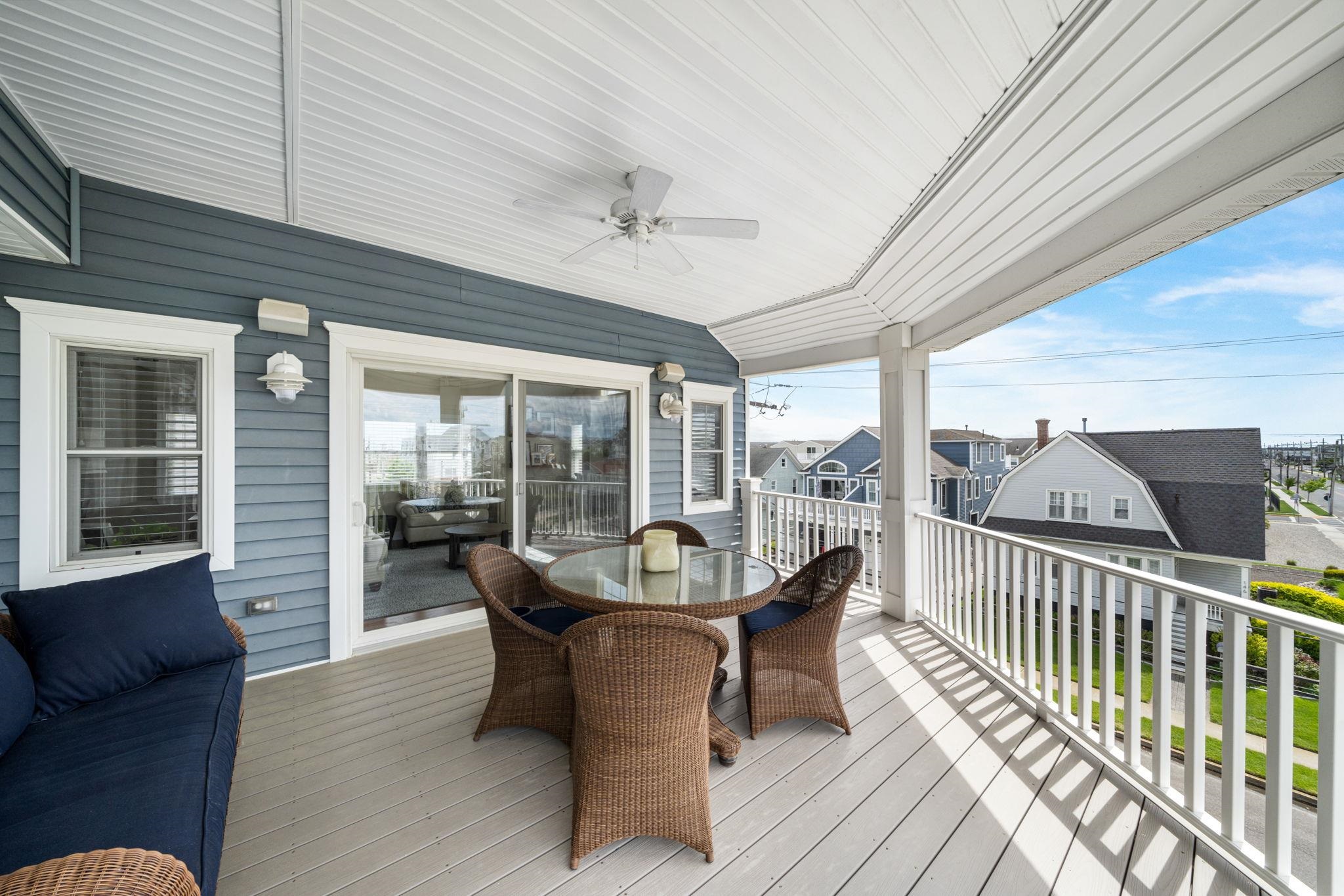 147 43rd Street Sea Isle City, NJ 08243 - Photo 16 of 50 a dining room with furniture wooden floor and chandelier