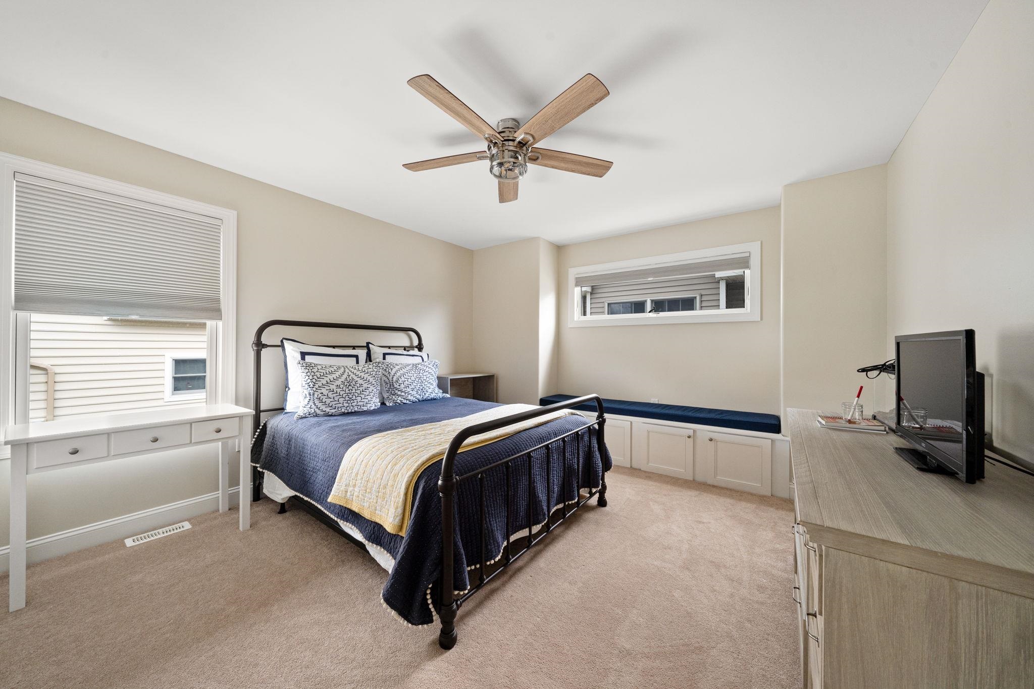 147 43rd Street Sea Isle City, NJ 08243 - Photo 24 of 50 a spacious bedroom with a bed and window