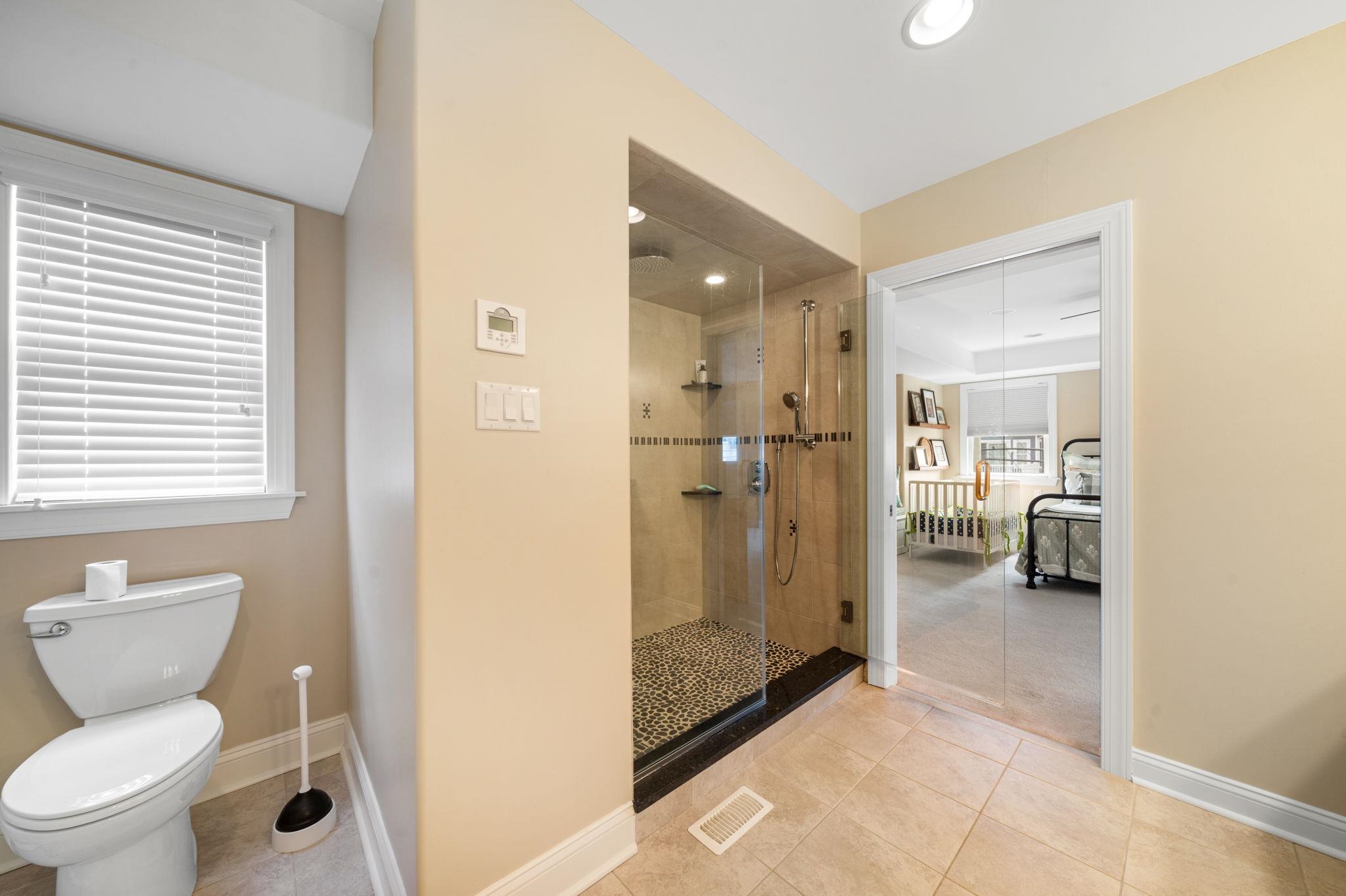 147 43rd Street Sea Isle City, NJ 08243 - Photo 28 of 50 a bathroom with a toilet and a shower