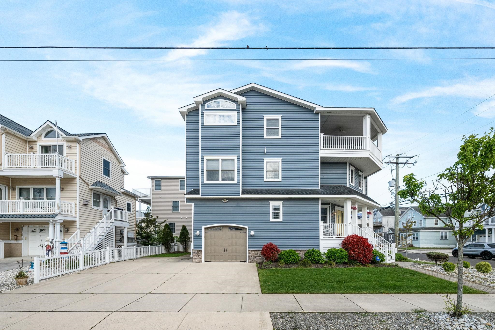 147 43rd Street Sea Isle City, NJ 08243 - Photo 39 of 50 a front view of a house with a yard