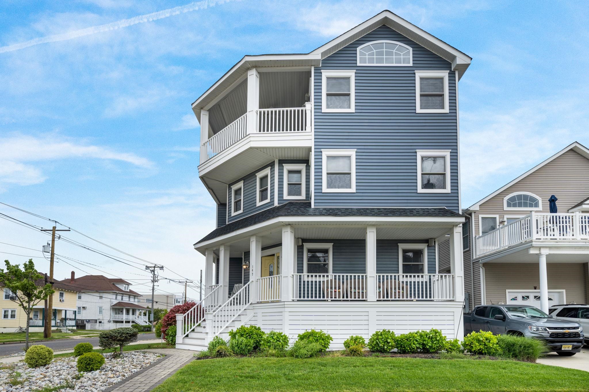 147 43rd Street Sea Isle City, NJ 08243 - Photo 40 of 50 a front view of a house with a yard