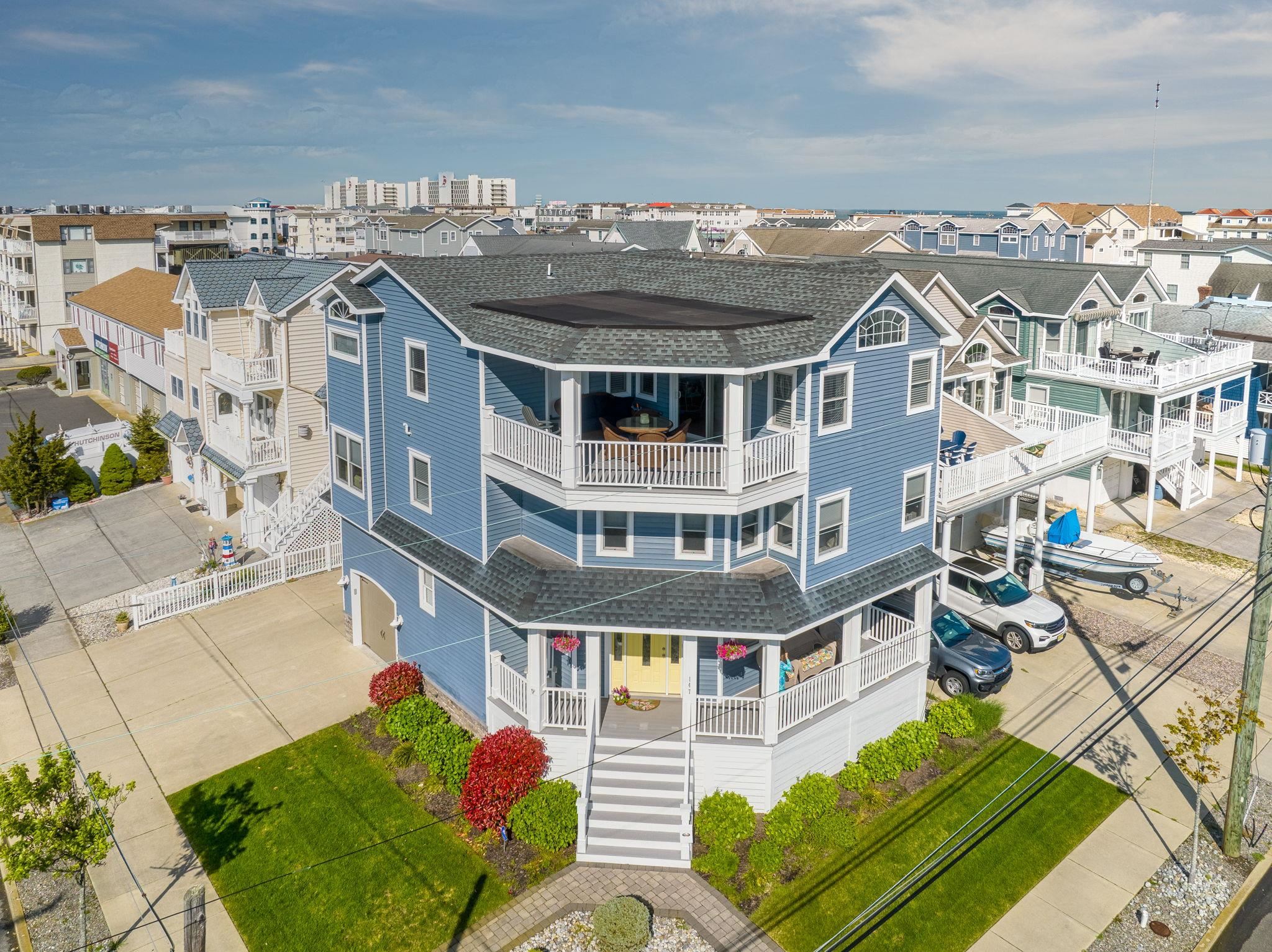 147 43rd Street Sea Isle City, NJ 08243 - Photo 42 of 50 a front view of a house with a yard