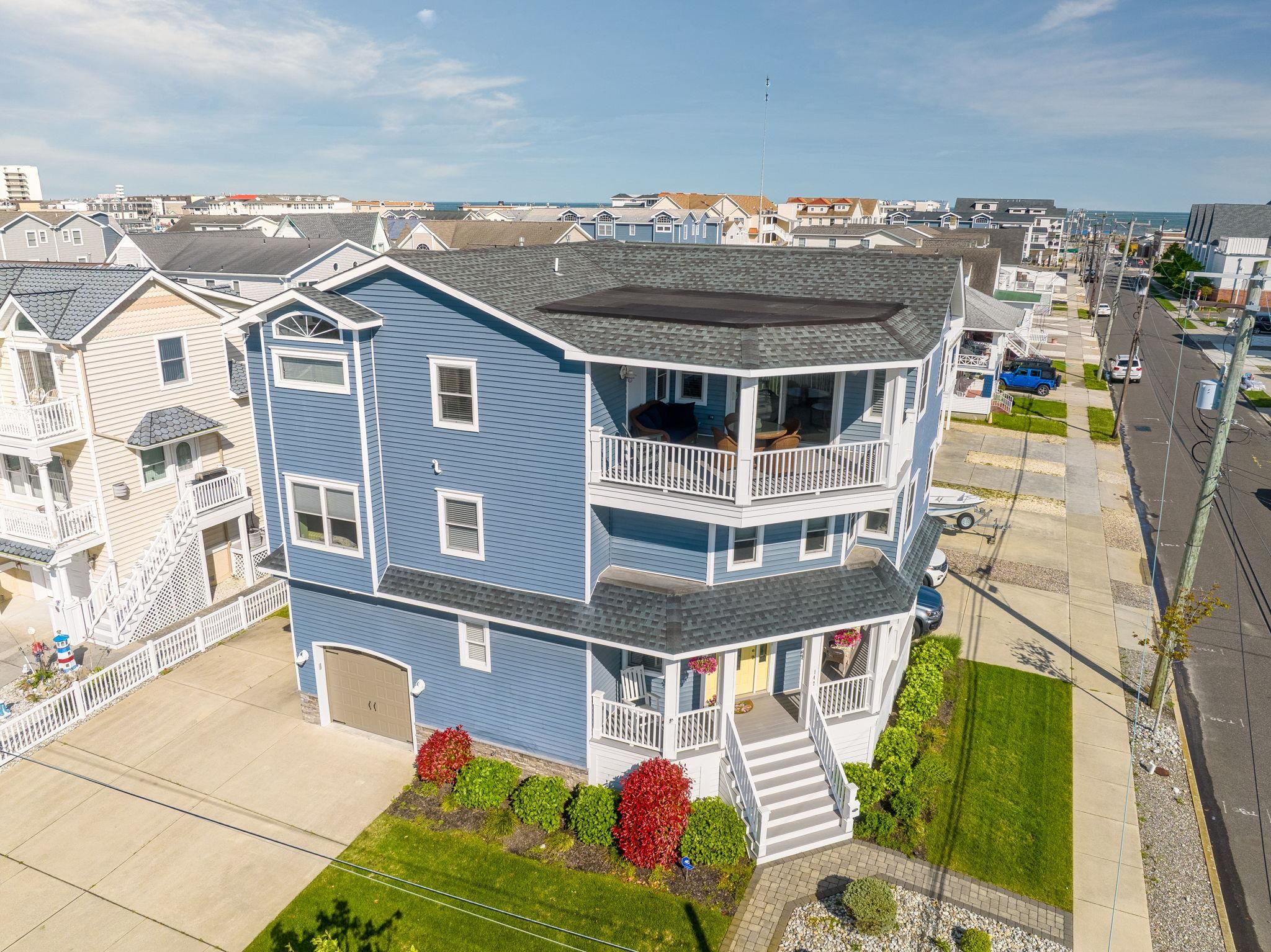 147 43rd Street Sea Isle City, NJ 08243 - Photo 44 of 50 a front view of a house with a garden
