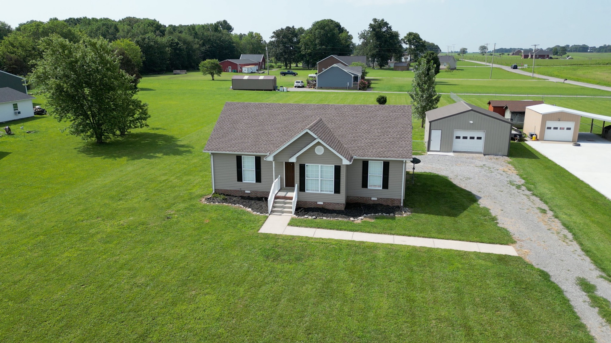444 Cook Road Portland, TN 37148 - Photo 2 of 26 a aerial view of a house with garden and big trees