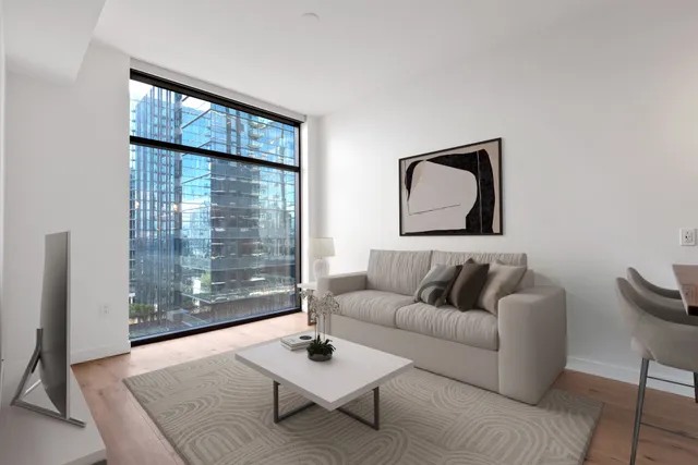 a view of kitchen and hall with wooden floor