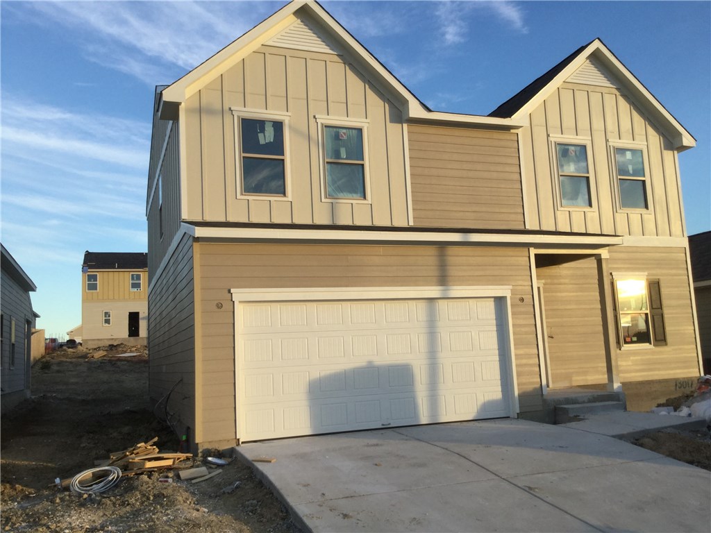 a view of a brick house with large windows