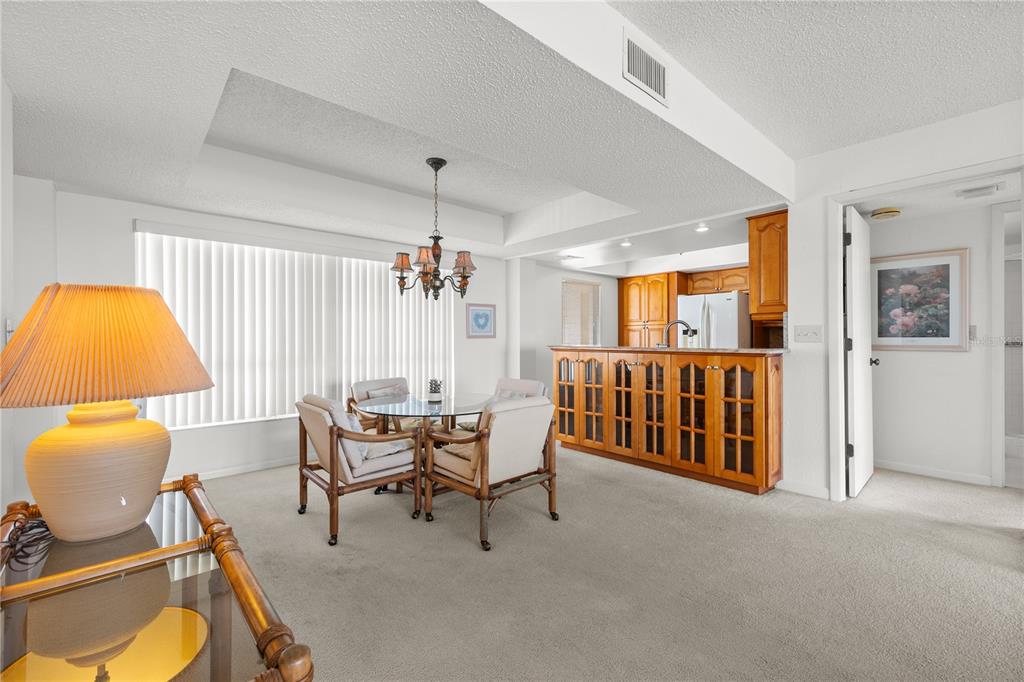 9000 Commodore Drive, Unit 604 Seminole, FL 33776 - Photo 16 of 50 a living room with furniture and a window