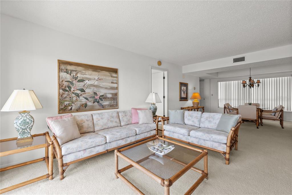 9000 Commodore Drive, Unit 604 Seminole, FL 33776 - Photo 20 of 50 a living room with furniture a rug and a window