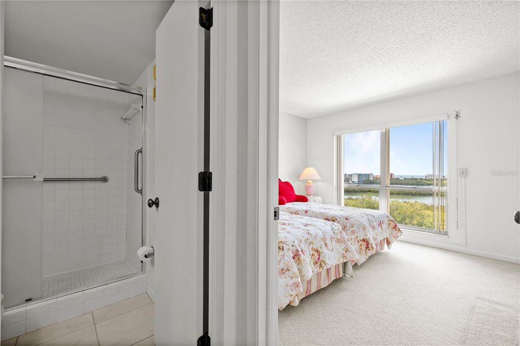 9000 Commodore Drive, Unit 604 Seminole, FL 33776 - Photo 21 of 50 a bed room with a bed and a window