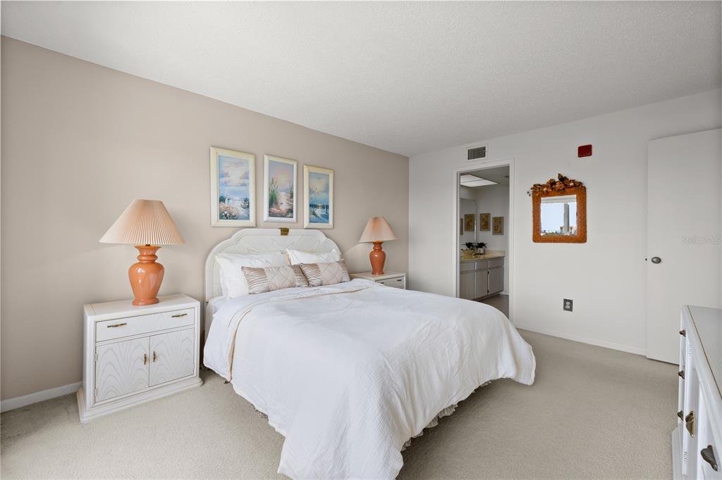 9000 Commodore Drive, Unit 604 Seminole, FL 33776 - Photo 26 of 50 a bedroom with bed and window