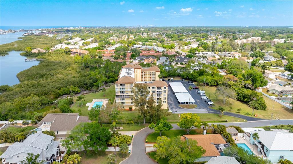 9000 Commodore Drive, Unit 604 Seminole, FL 33776 - Photo 36 of 50 an aerial view of residential houses with outdoor space