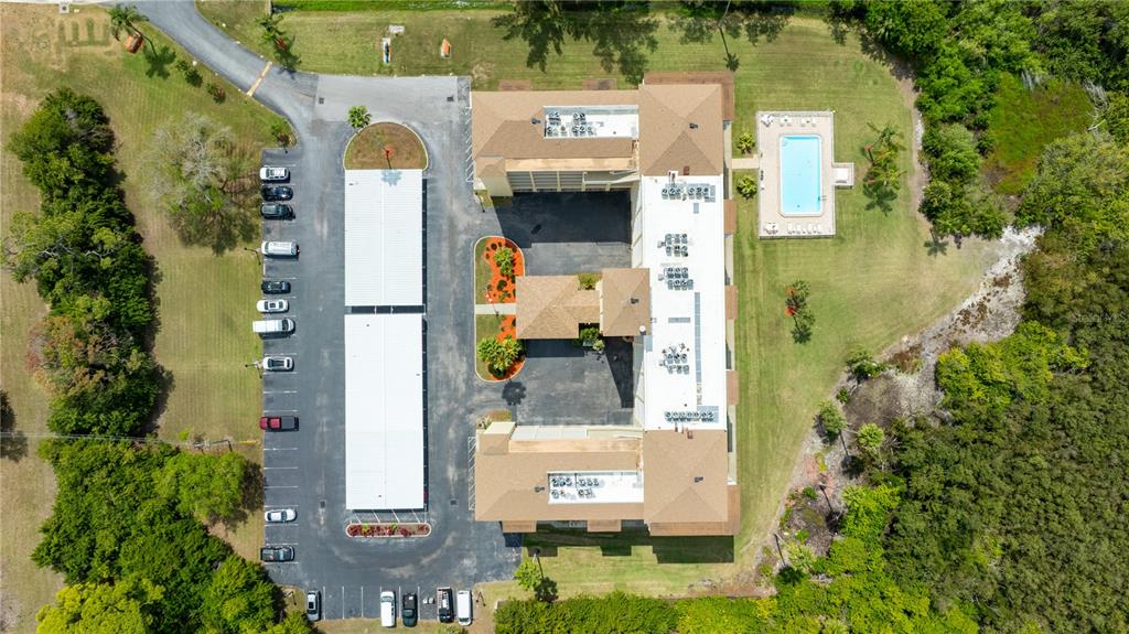9000 Commodore Drive, Unit 604 Seminole, FL 33776 - Photo 41 of 50 an aerial view of residential houses with outdoor space