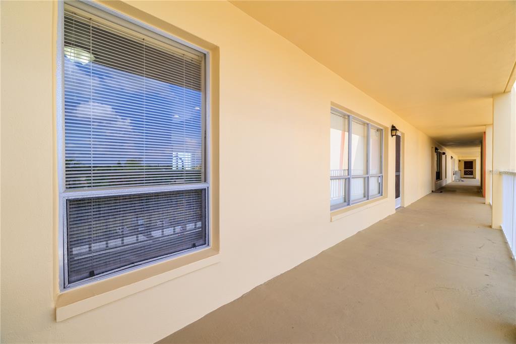 9000 Commodore Drive, Unit 604 Seminole, FL 33776 - Photo 43 of 50 a view of livingroom and window