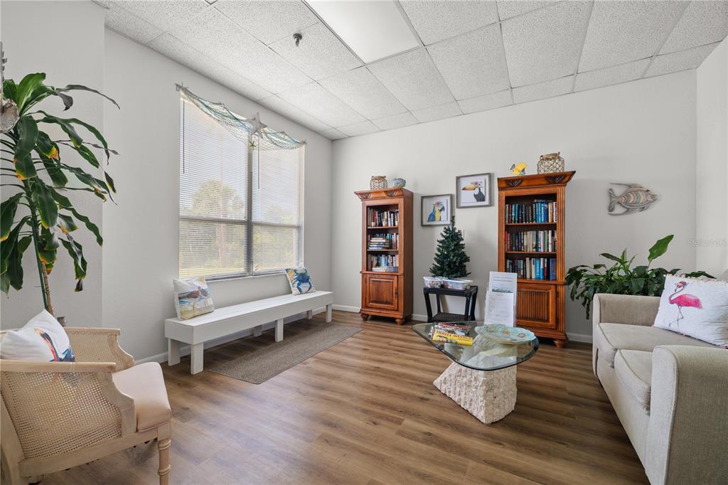 9000 Commodore Drive, Unit 604 Seminole, FL 33776 - Photo 48 of 50 a living room with furniture and a potted plant