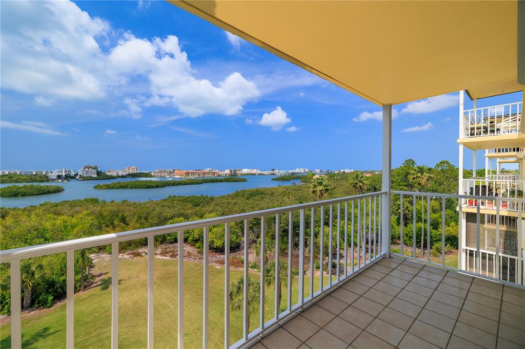 9000 Commodore Drive, Unit 604 Seminole, FL 33776 - Photo 8 of 50 a view of a balcony with city view