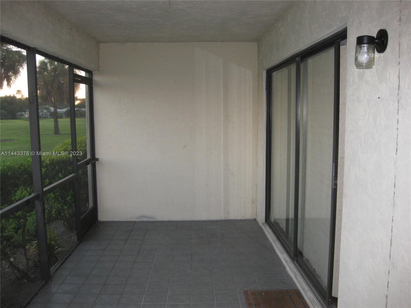801 Pinecrest Circle, Unit E Jupiter, FL 33458 - Photo 15 of 18 a view of a glass door