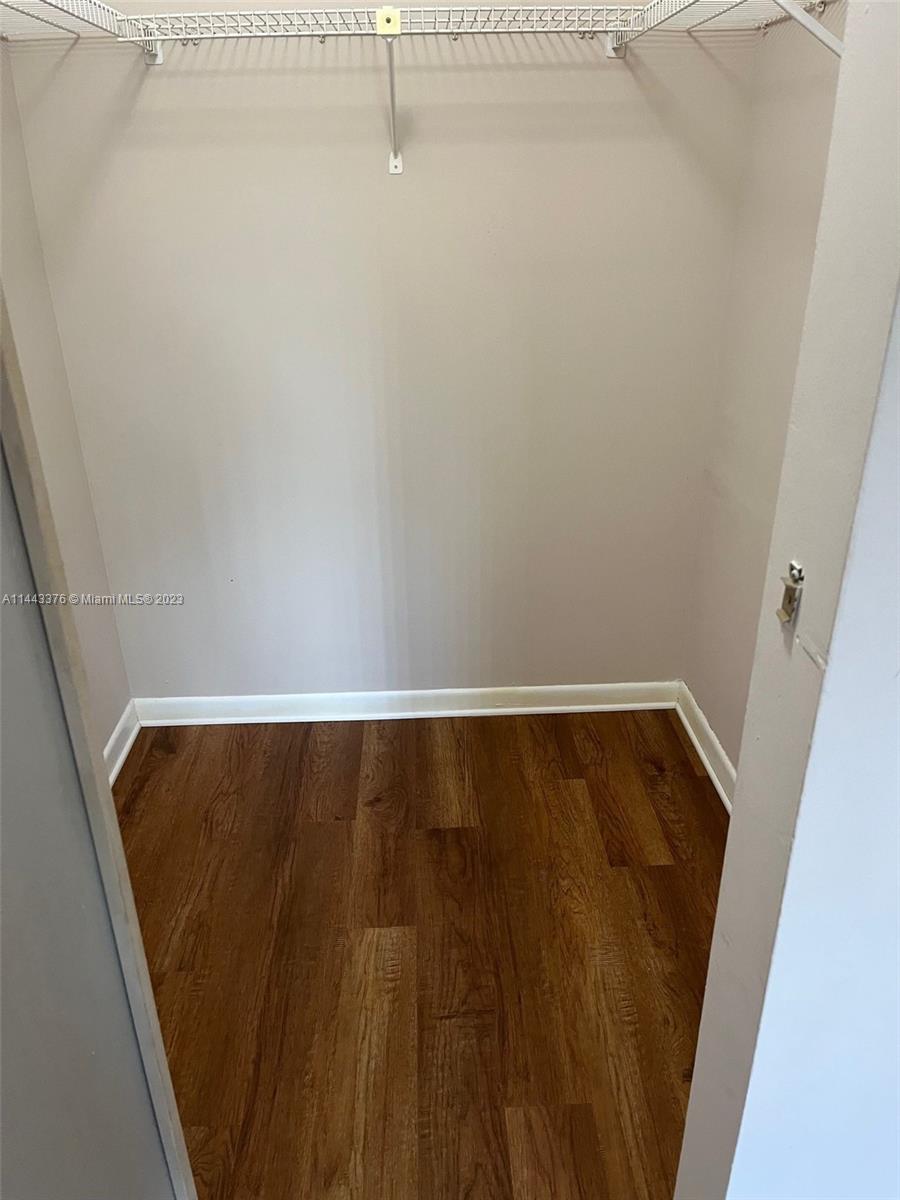 801 Pinecrest Circle, Unit E Jupiter, FL 33458 - Photo 7 of 18 a view of wooden floor