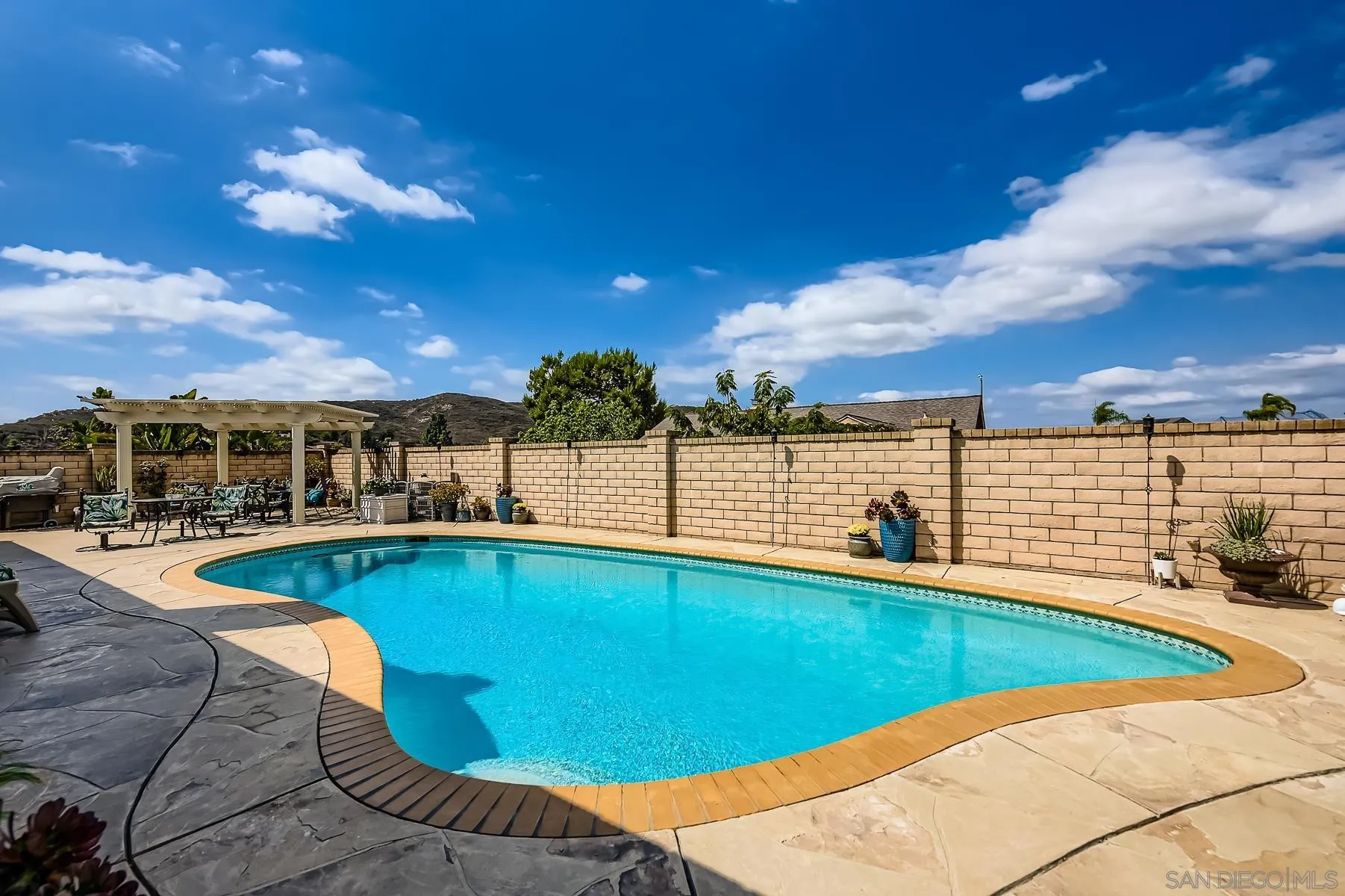 12450 Robison Boulevard Poway, CA 92064 - Photo 29 of 32 a view of a swimming pool with an outdoor seating