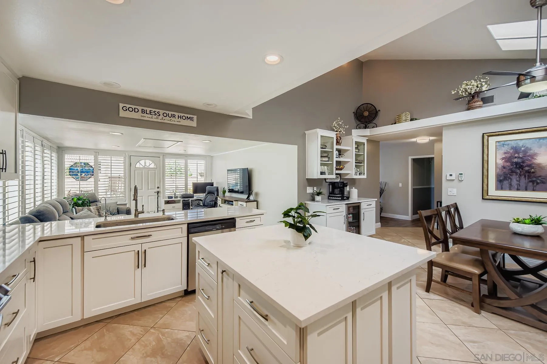 12450 Robison Boulevard Poway, CA 92064 - Photo 7 of 32 a kitchen with a sink a stove cabinets and living room