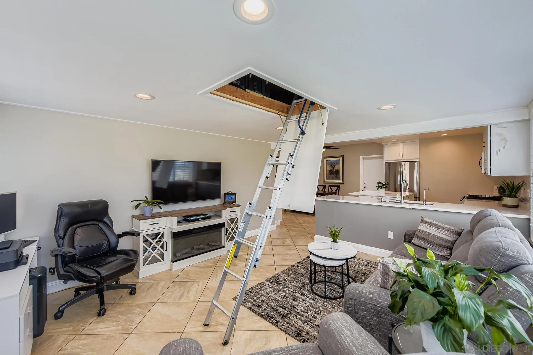 12450 Robison Boulevard Poway, CA 92064 - Photo 10 of 32 a living room with furniture and a flat screen tv