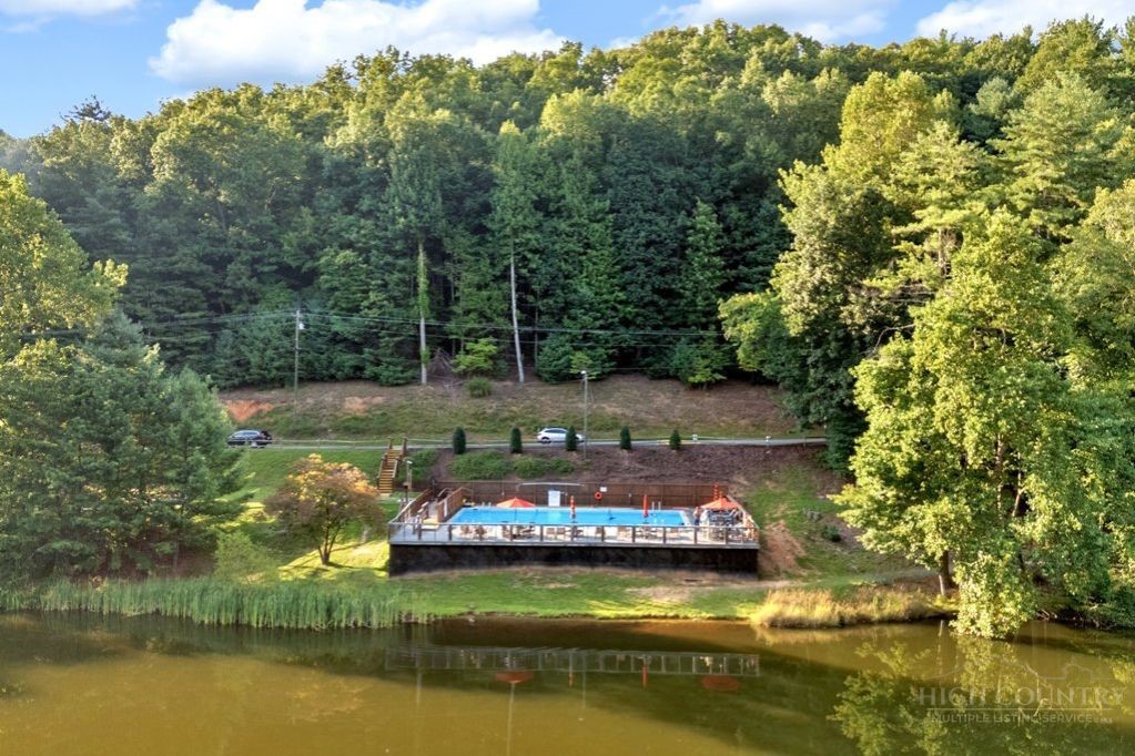 216 Saddle Lane Deep Gap, NC 28618 - Photo 39 of 44 a view of a lake with house
