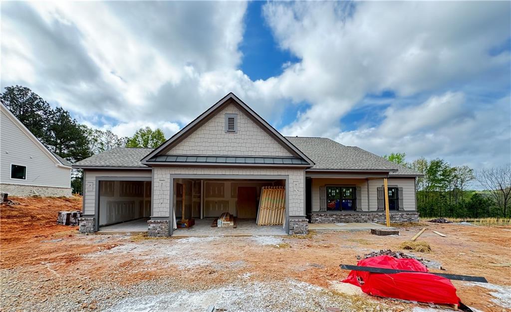 a front view of a house with yard and seating area