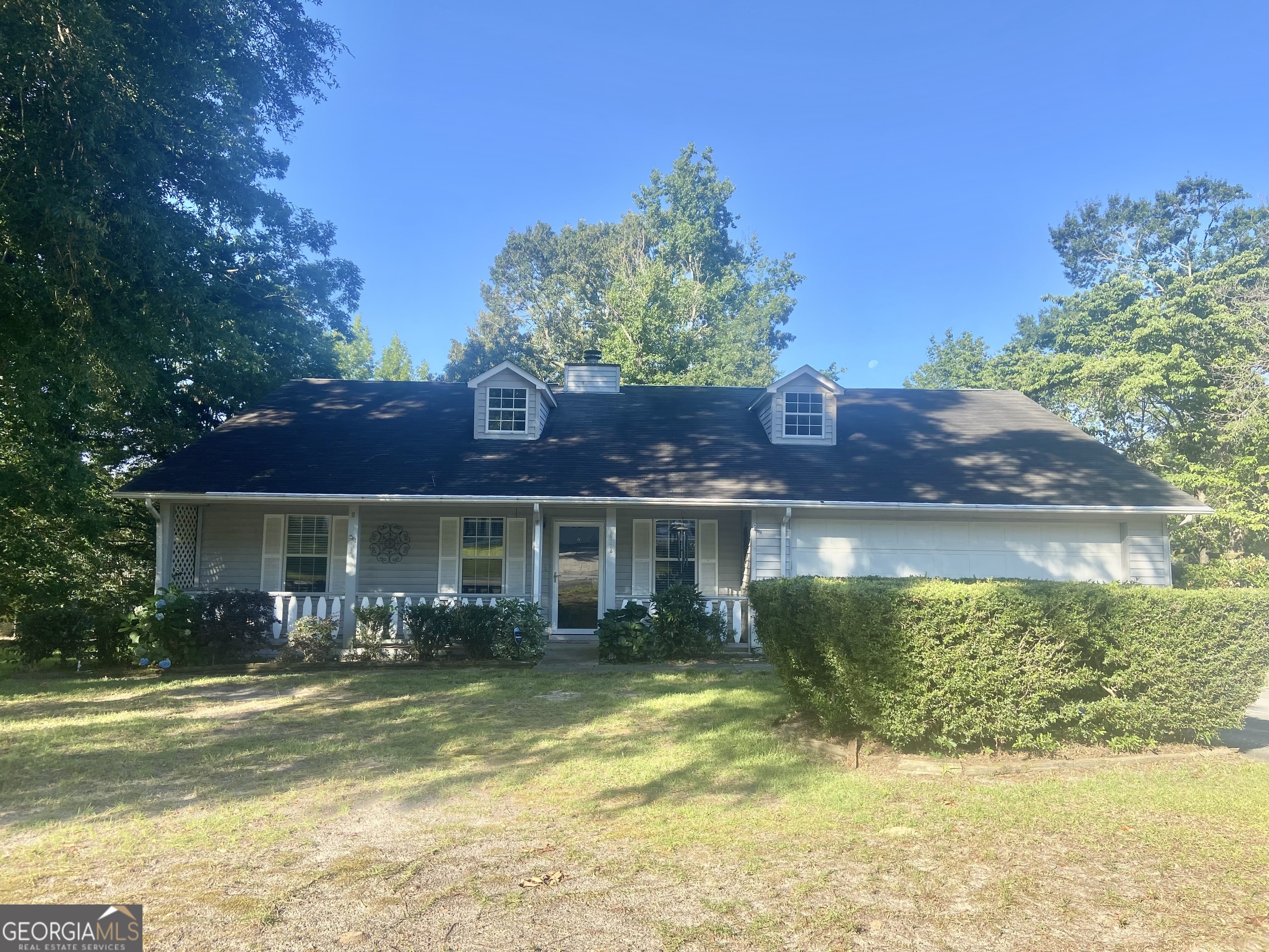 a view of a house with a swimming pool