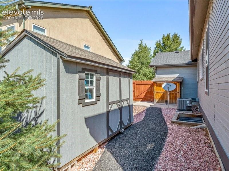 12113 Point Reyes Drive Peyton, CO 80831 - Photo 31 of 34 Side Yard with sheds