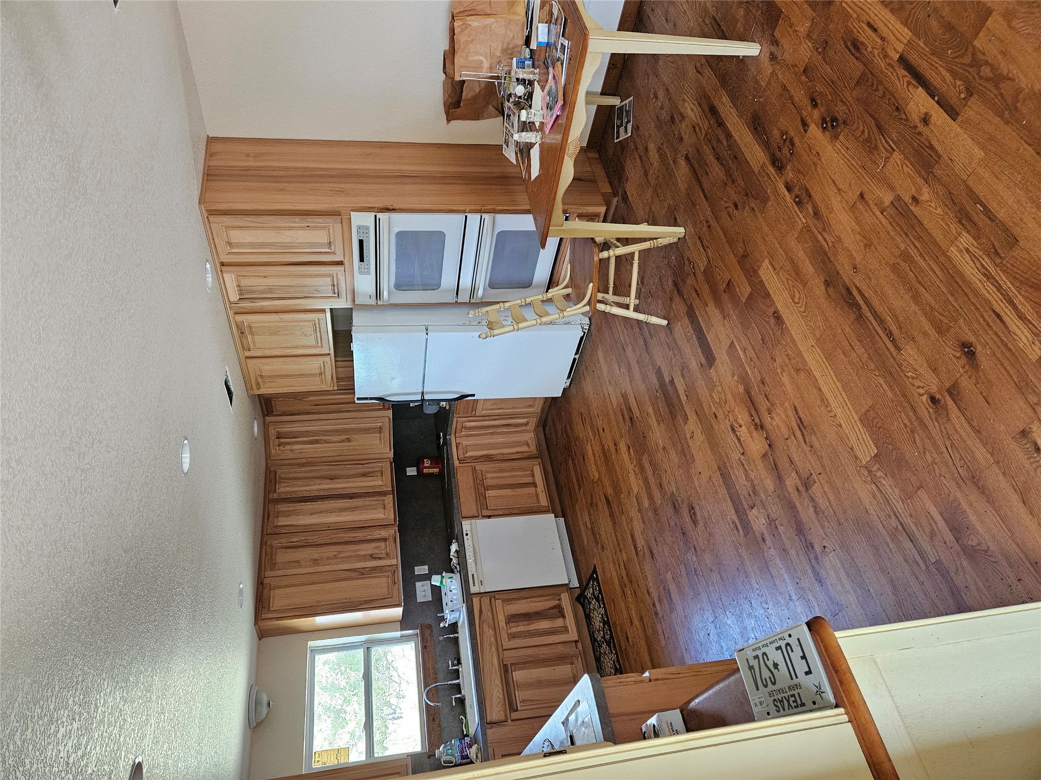 1988 Cr 116 Road Rogers, TX 76569 - Photo 13 of 16 a living room with furniture and a wooden floor