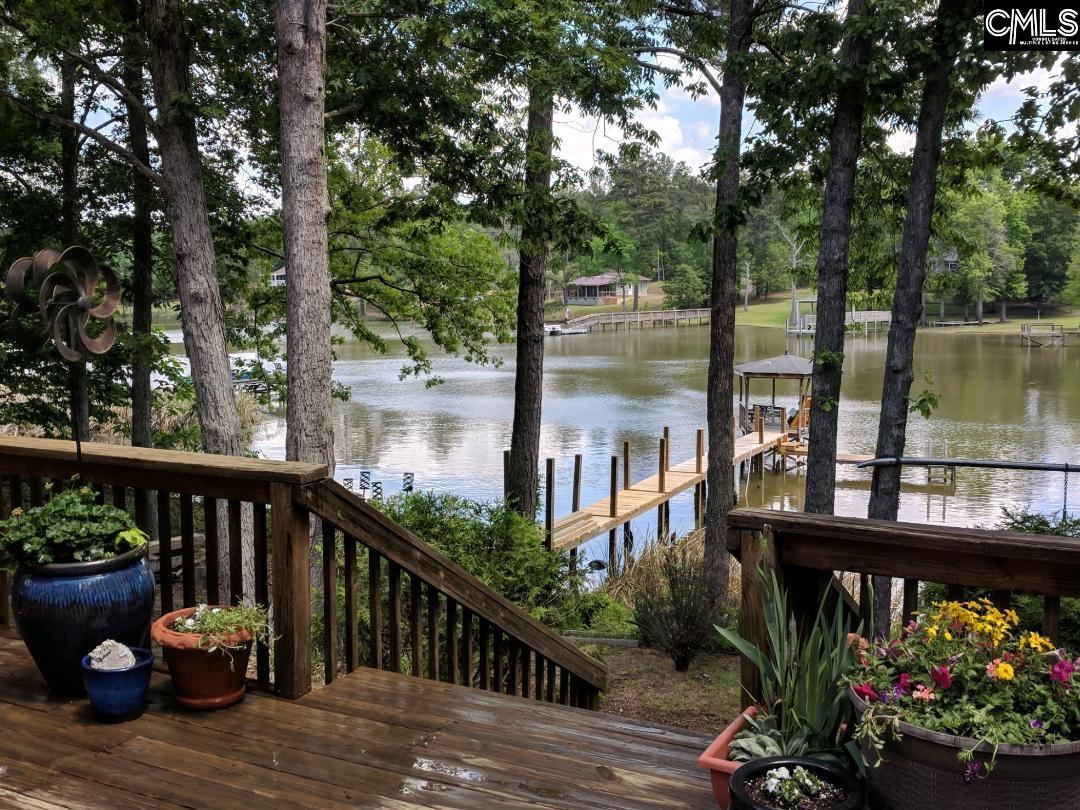 957 Rocky Point Circle Ridgeway, SC 29130 - Photo 2 of 23 a view of a two chairs and table in the balcony