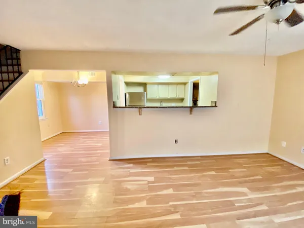 a view of a room with wooden floor and cabinet