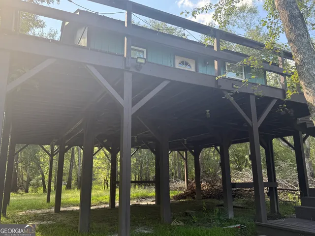 a view of a chairs and table in the patio