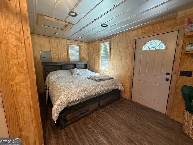 a bedroom with a bed and a mirror