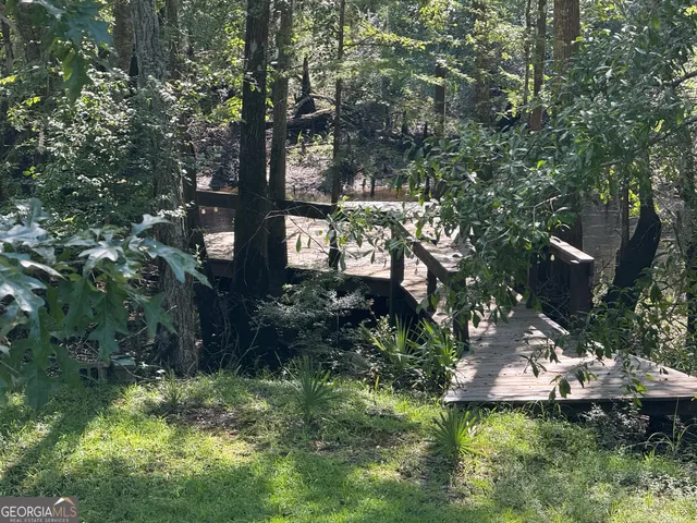 a backyard of a house with lots of green space