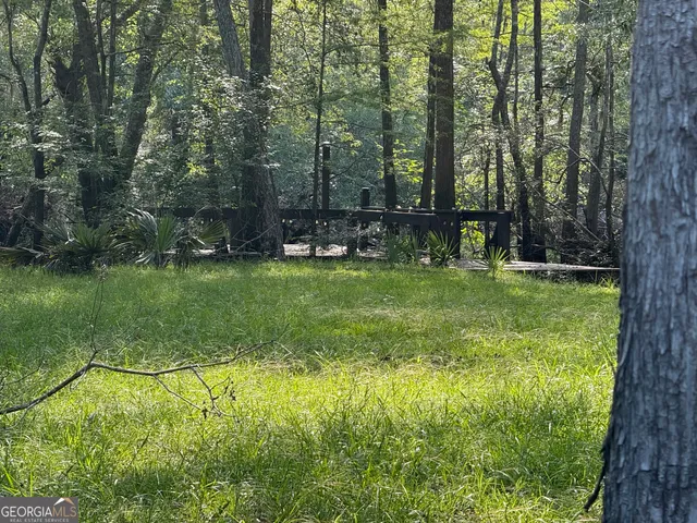 a view of swimming pool with a yard