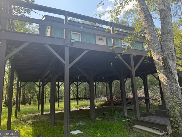 a view of a chairs and table in the patio