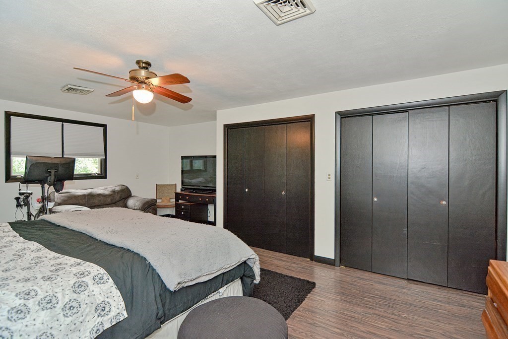 237 Kaufman Road Somerset, MA 02726 - Photo 23 of 38 a bedroom with a bed and a chandelier