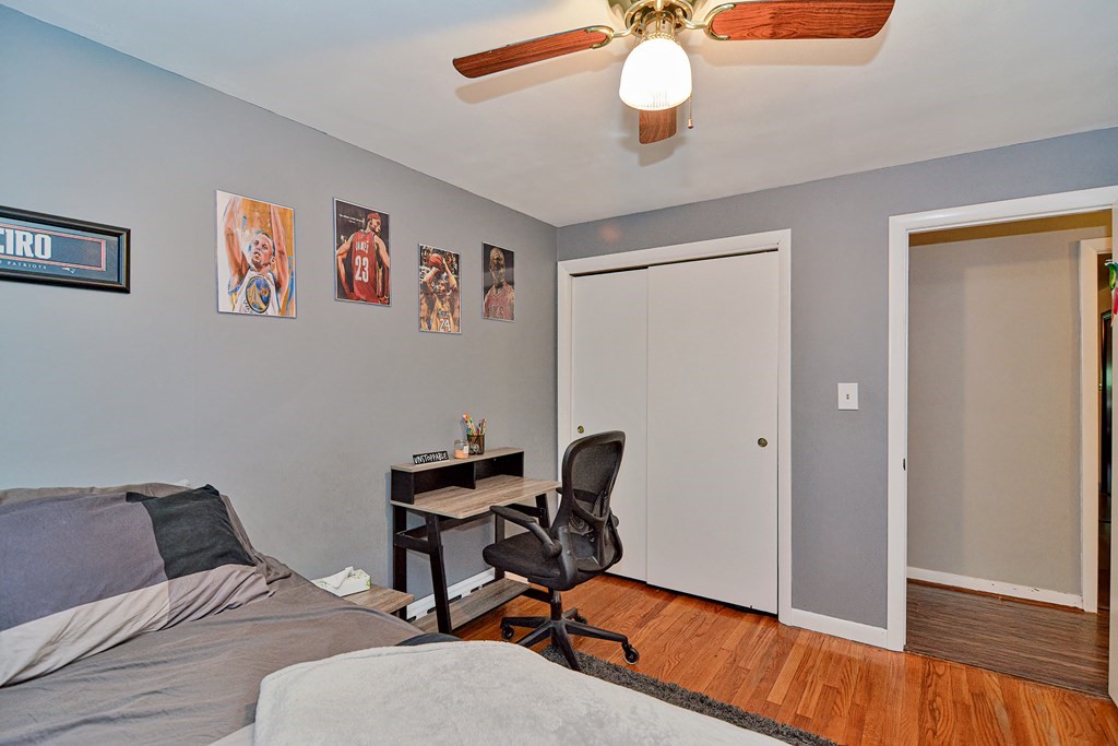 237 Kaufman Road Somerset, MA 02726 - Photo 31 of 38 a bedroom with a bed and a chandelier